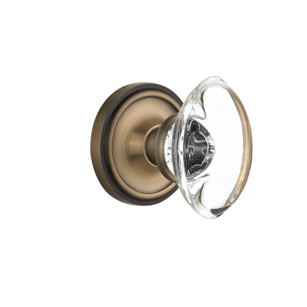 Nostalgic Warehouse CLAOCC Mortise Classic Rose with Oval Clear Crystal Knob in Antique Brass